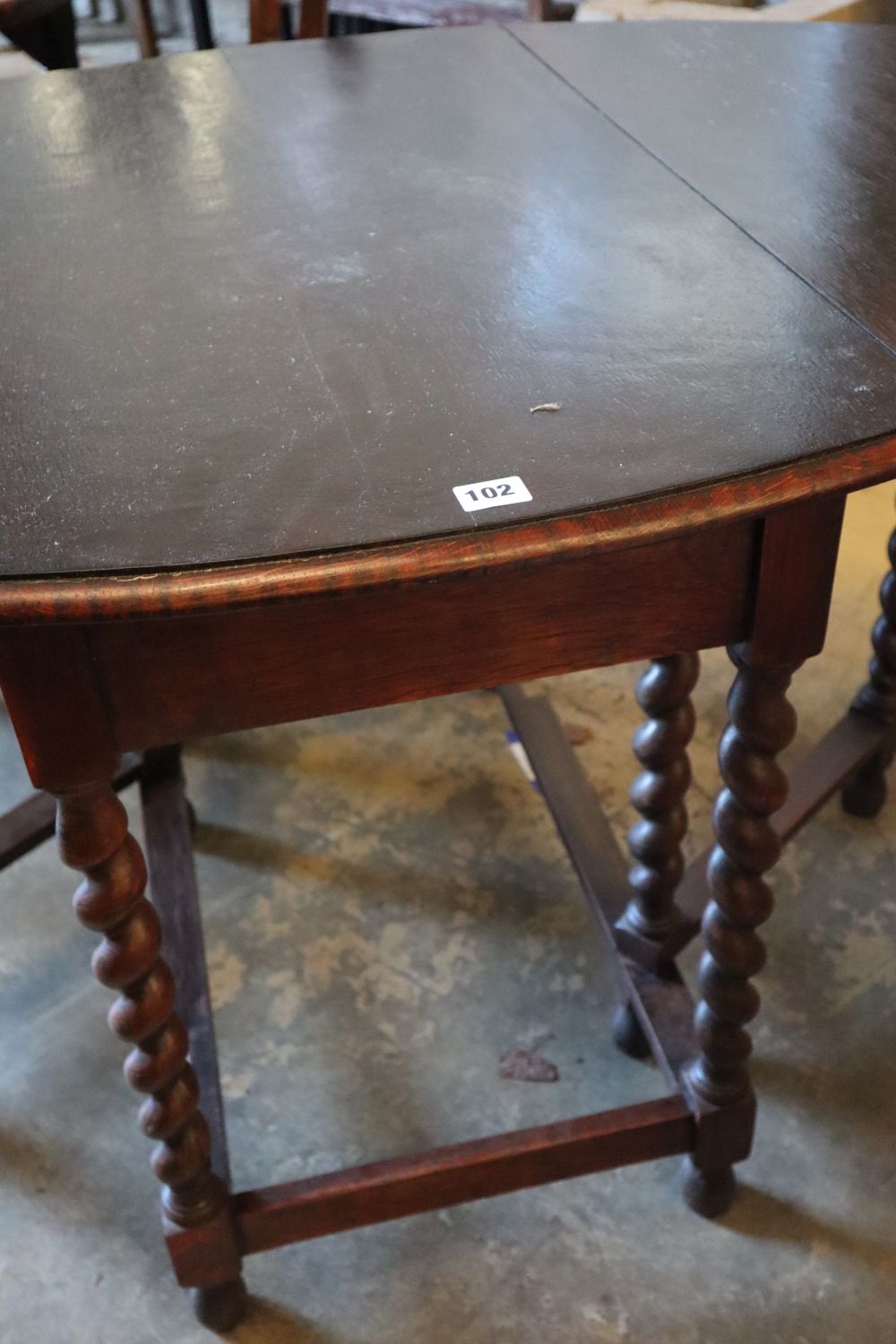A 1920s oak gateleg table, with spiral twist underframe, width 91cm
